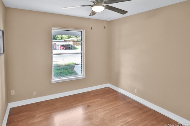 unfurnished room with wood-type flooring and ceiling fan