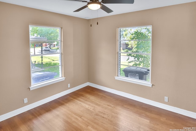 spare room featuring ceiling fan and hardwood / wood-style flooring