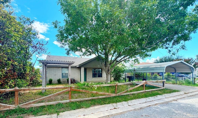 133 Rio Grande St, Uvalde, TX 78801 - ranch-style house with brick siding and a carport