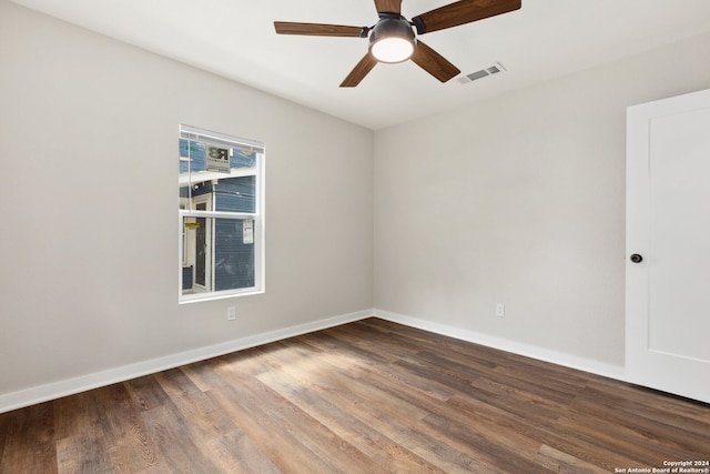 unfurnished room with ceiling fan and hardwood / wood-style flooring