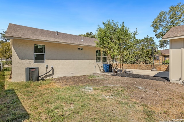 back of house with a patio and central AC unit