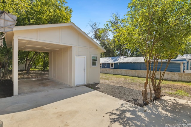 garage featuring a carport