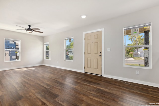 entrance foyer featuring dark hardwood / wood-style floors, ceiling fan, and plenty of natural light