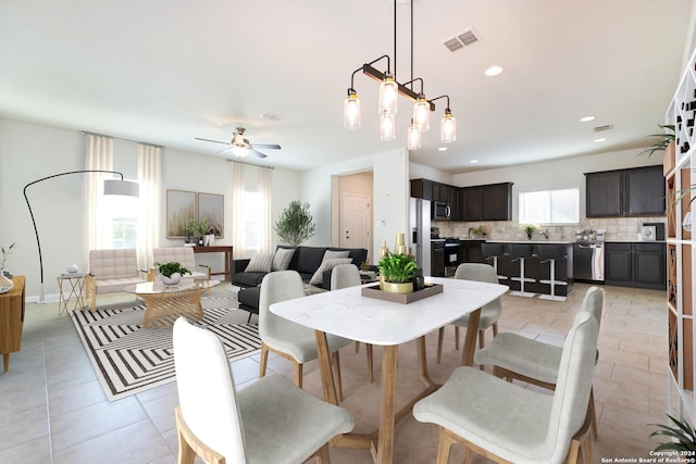 dining room with a ceiling fan, light tile patterned floors, recessed lighting, and visible vents