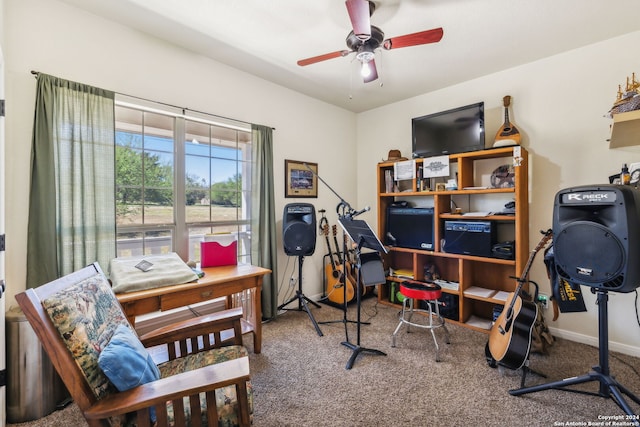 carpeted office space featuring ceiling fan