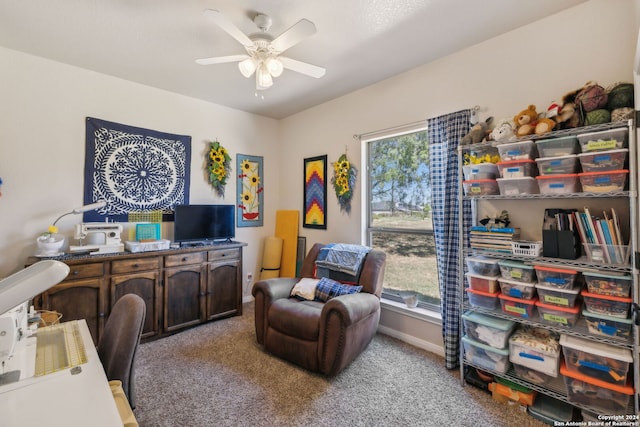 office area featuring ceiling fan and light colored carpet