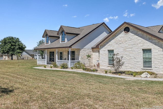 view of front of house featuring a front lawn and covered porch