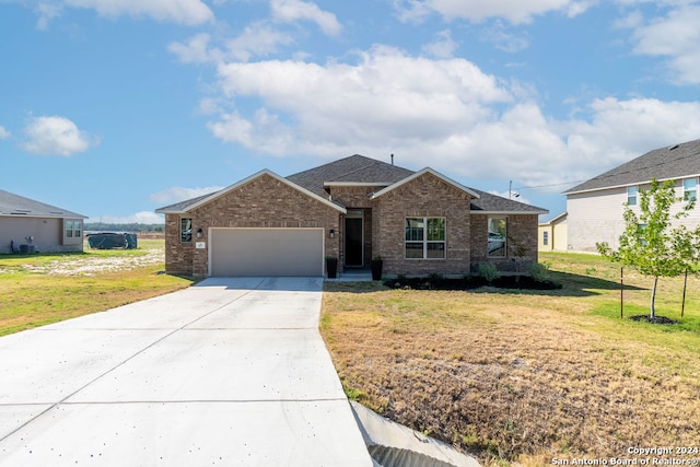 ranch-style home featuring a front yard and a garage