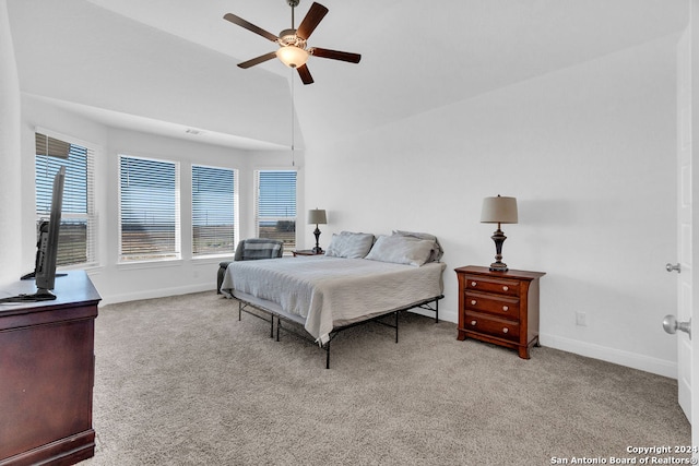 carpeted bedroom featuring vaulted ceiling and ceiling fan