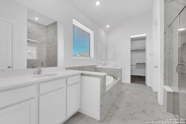 bathroom with shower with separate bathtub, lofted ceiling, and vanity