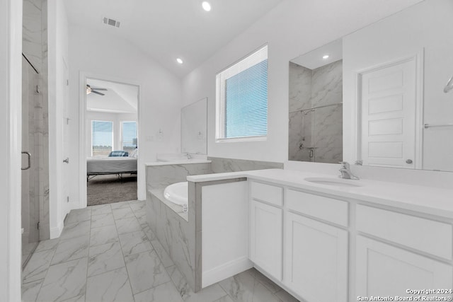 bathroom featuring shower with separate bathtub, vaulted ceiling, ceiling fan, and vanity