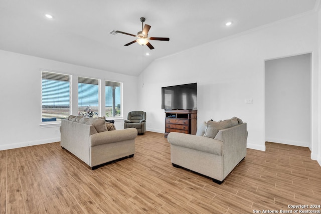 living room featuring light wood-type flooring, crown molding, lofted ceiling, and ceiling fan