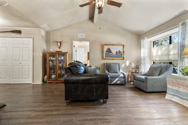 living room with ceiling fan, dark hardwood / wood-style floors, and lofted ceiling with beams