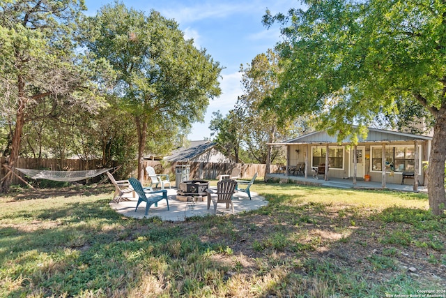 view of yard with a patio area and an outdoor fire pit