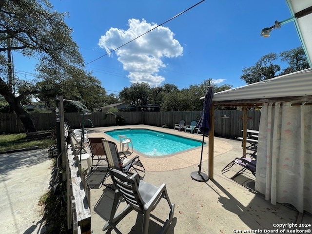 view of pool with a patio area