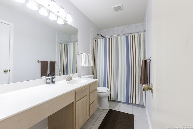 bathroom with toilet, vanity, tile patterned floors, and a shower with shower curtain