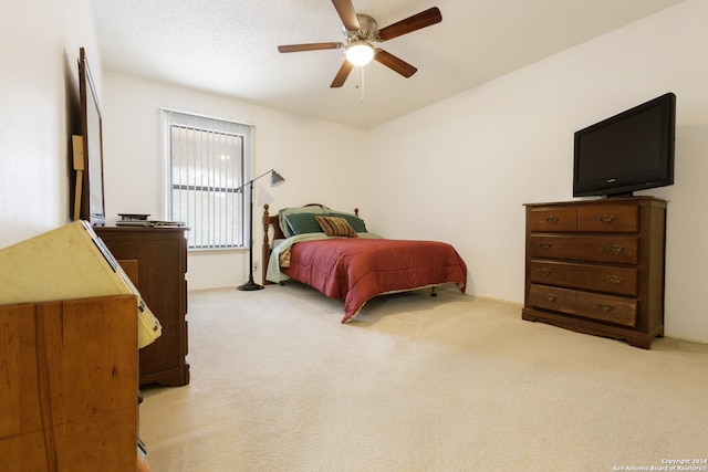 bedroom featuring ceiling fan and light colored carpet