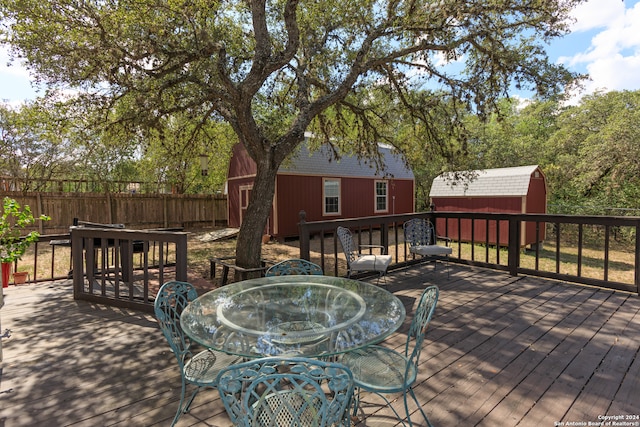 wooden terrace with a storage unit