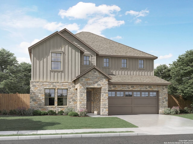 view of front of house featuring a garage and a front lawn