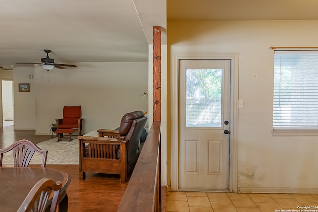 entryway with ceiling fan and light tile patterned floors