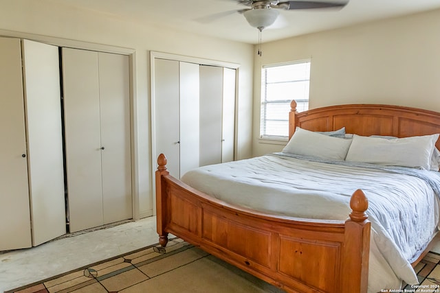 bedroom featuring two closets and ceiling fan