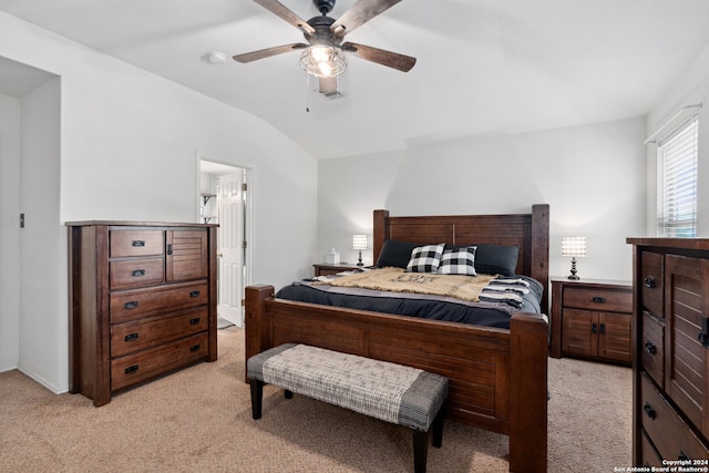 carpeted bedroom featuring lofted ceiling and ceiling fan