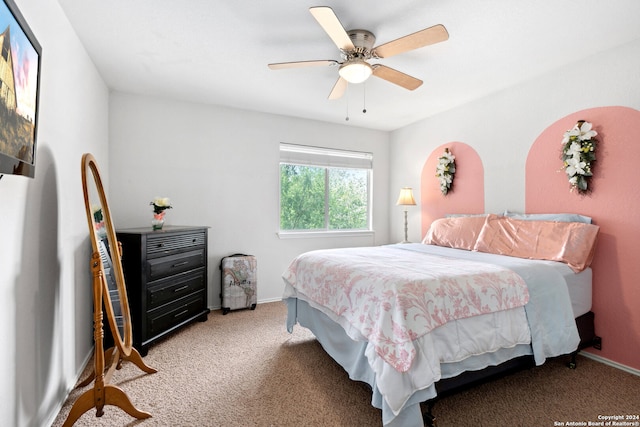 bedroom with ceiling fan and carpet floors