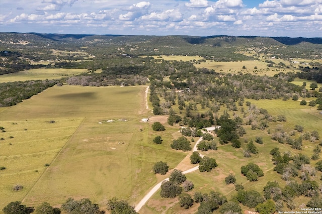 drone / aerial view featuring a mountain view and a rural view