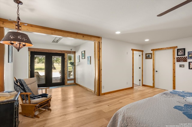 bedroom with access to outside, french doors, light hardwood / wood-style floors, and ceiling fan