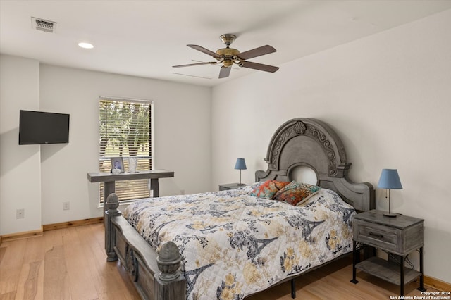 bedroom with ceiling fan and light hardwood / wood-style flooring