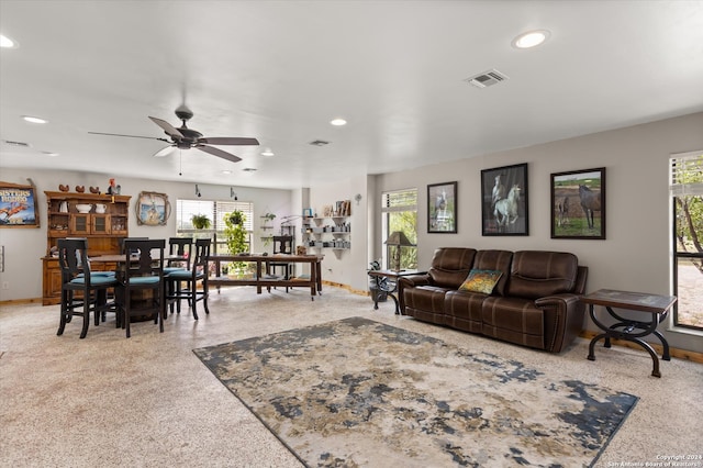 living room with ceiling fan and plenty of natural light