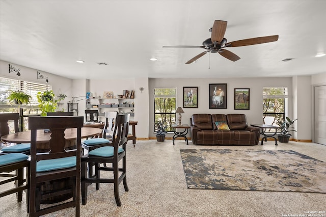 dining room featuring light carpet and ceiling fan