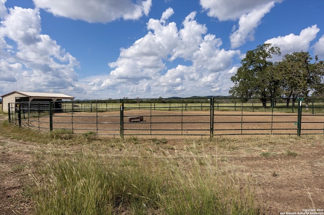 view of yard with a rural view