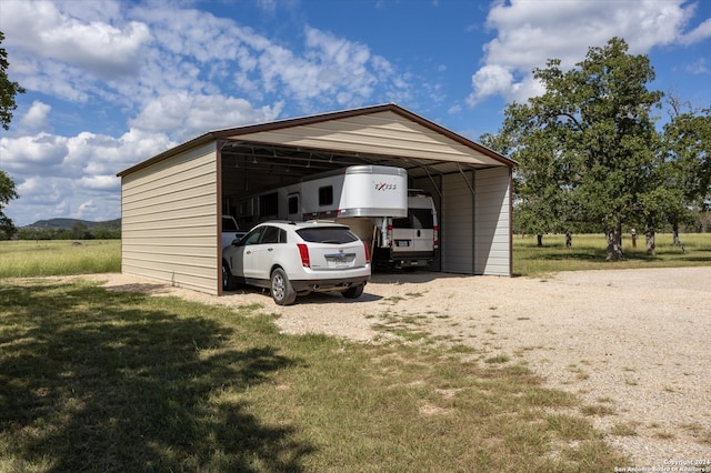 exterior space featuring a carport and a yard