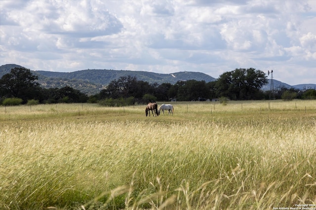 property view of mountains featuring a rural view