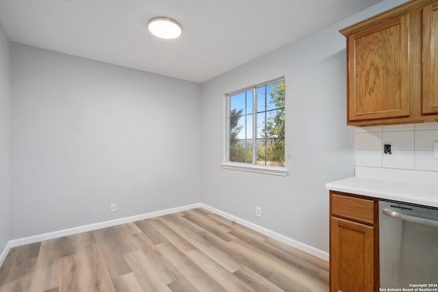 unfurnished dining area with light hardwood / wood-style flooring