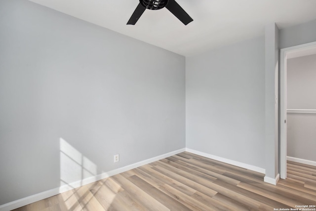 interior space with a closet, light hardwood / wood-style floors, and ceiling fan