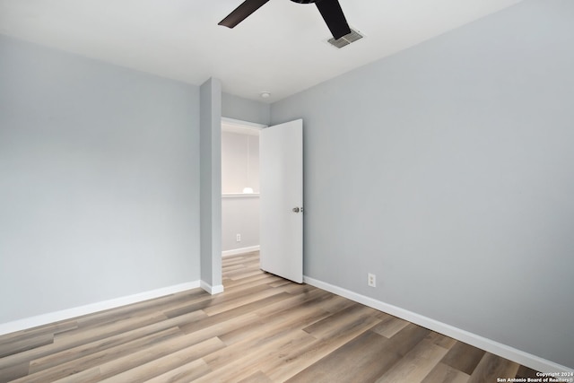 empty room featuring light hardwood / wood-style flooring and ceiling fan