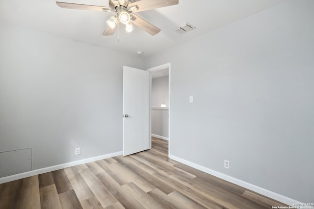 unfurnished room with light hardwood / wood-style floors and ceiling fan