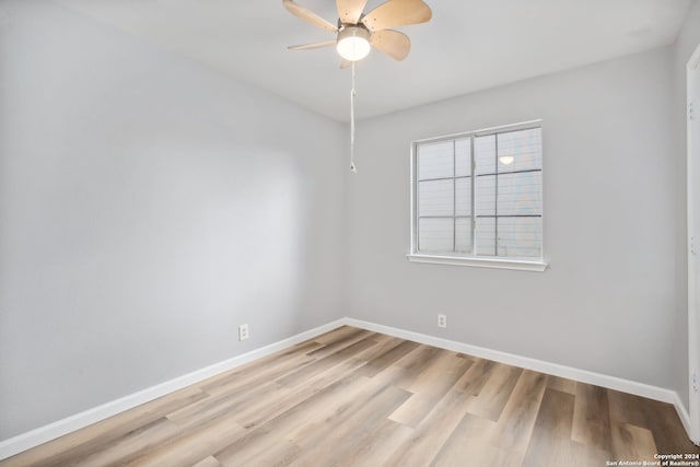 empty room with light hardwood / wood-style flooring and ceiling fan