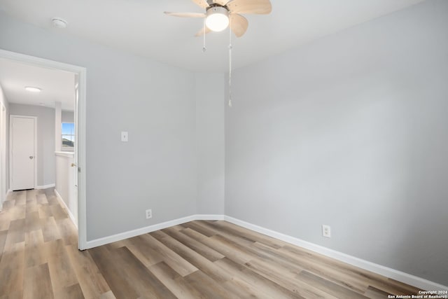 unfurnished room featuring light hardwood / wood-style floors and ceiling fan