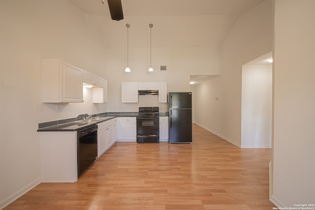 kitchen featuring light wood-type flooring, white cabinetry, high vaulted ceiling, and black appliances