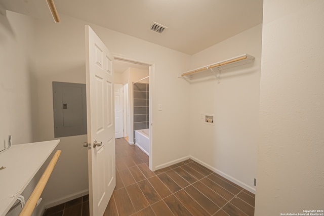 laundry area featuring electric panel and washer hookup