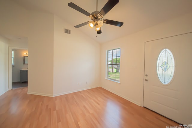 entrance foyer with ceiling fan, light wood-type flooring, and high vaulted ceiling