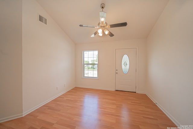 foyer entrance featuring lofted ceiling, ceiling fan, and light hardwood / wood-style floors