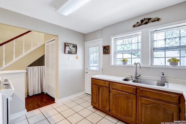 kitchen with light tile patterned flooring and sink