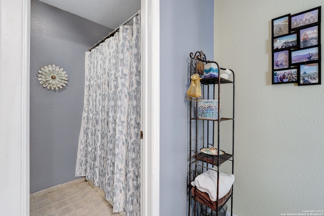 bathroom featuring a textured ceiling