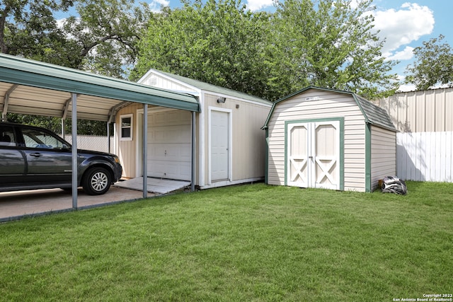 garage with a lawn, wooden walls, and a carport