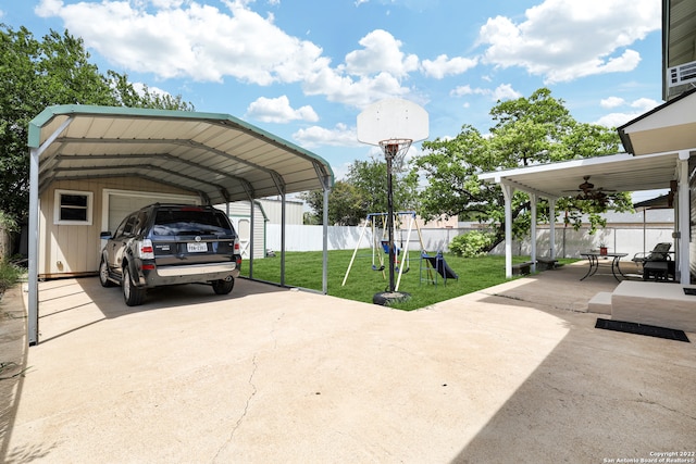 view of vehicle parking with a lawn and a carport