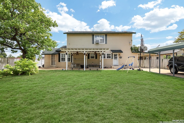 back of property featuring a lawn and a patio area